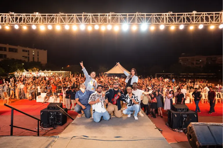 20Hz Live band posing on stage with a large audience after a live concert
